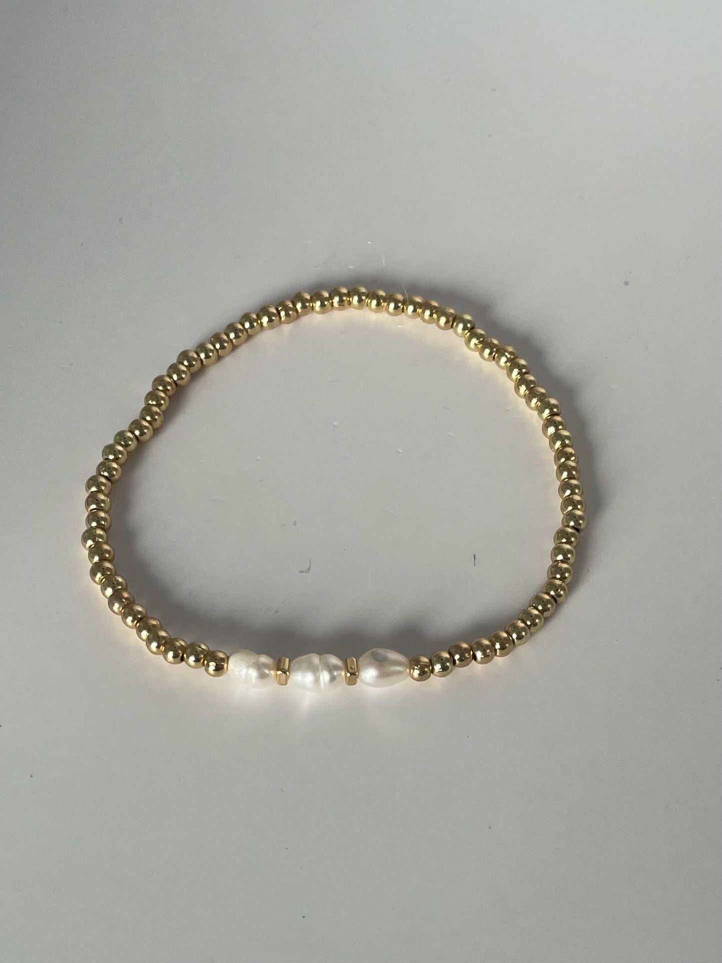 Stretch armband gold/parel