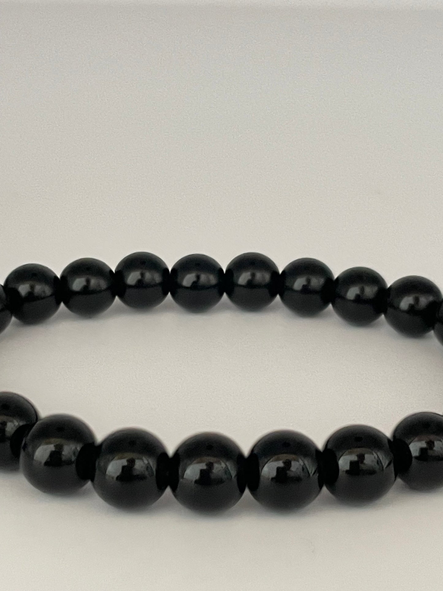 Stretch armband kralen zwart shine 4 mm
